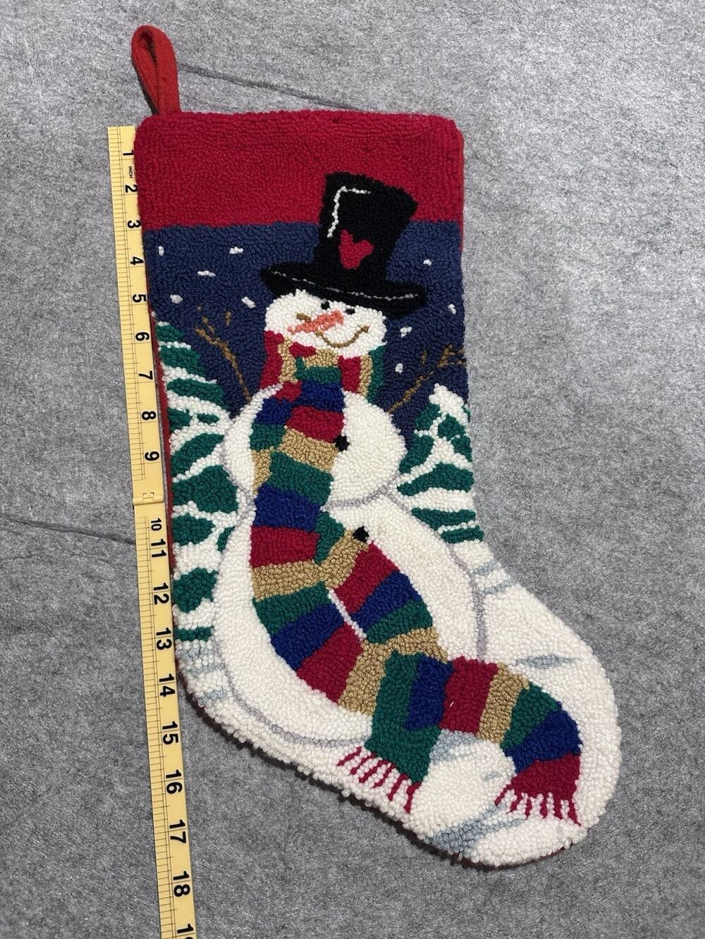 vintage latch hook and needlepoint-style Christmas stocking featuring a snowman